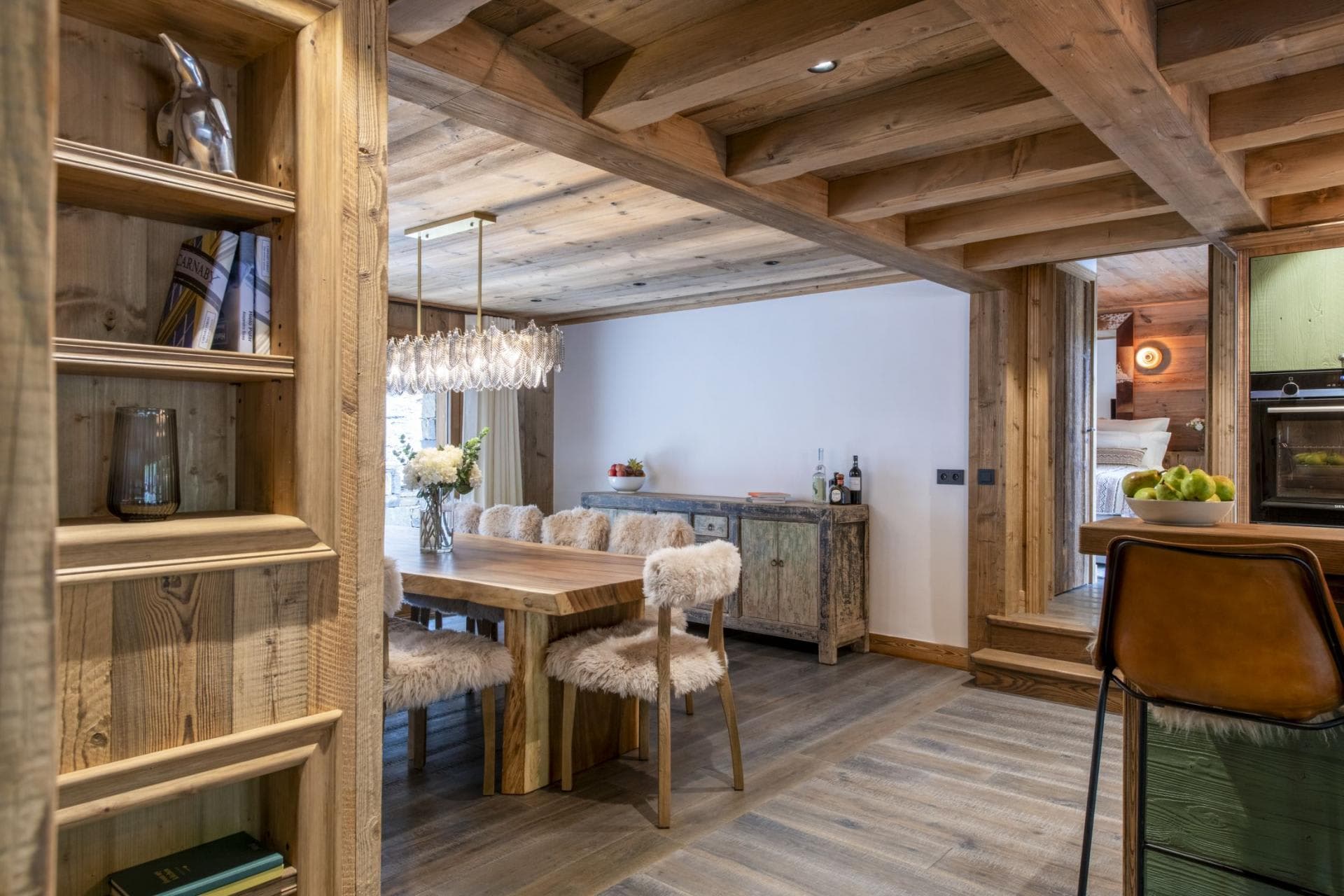 Dining area with live-edge table and access to bedroom level