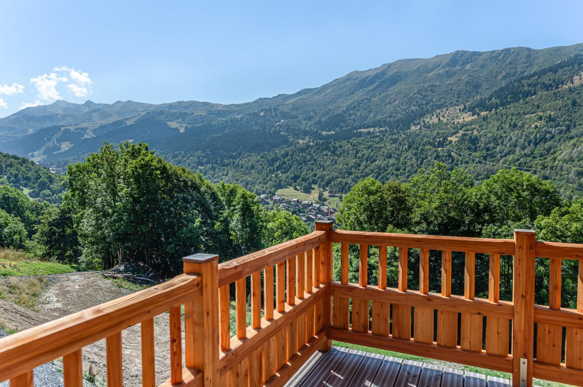 Private wooden balcony with views of Meribel Valley and surrounding mountains