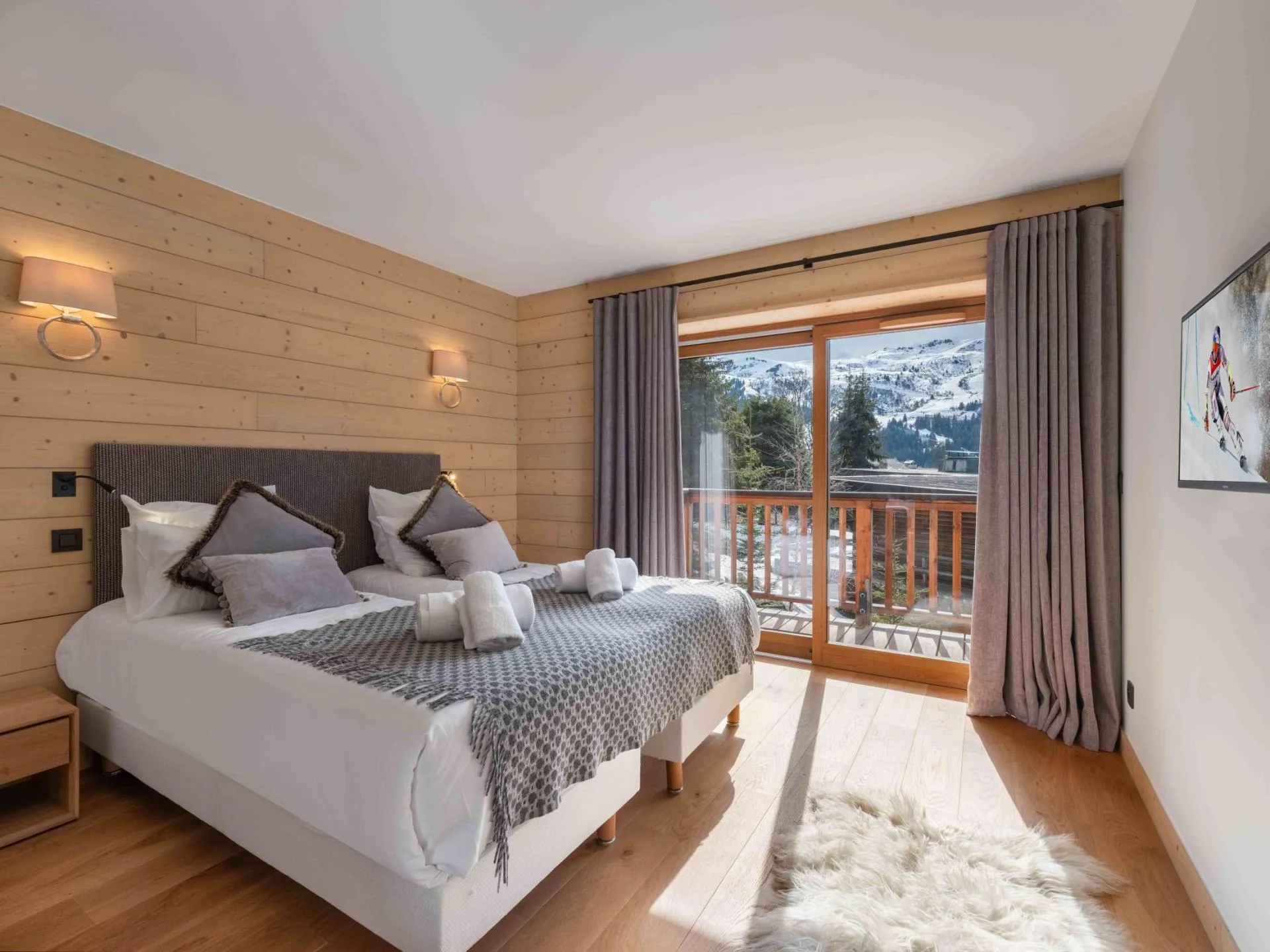 Twin bedroom with timber walls and mountain views