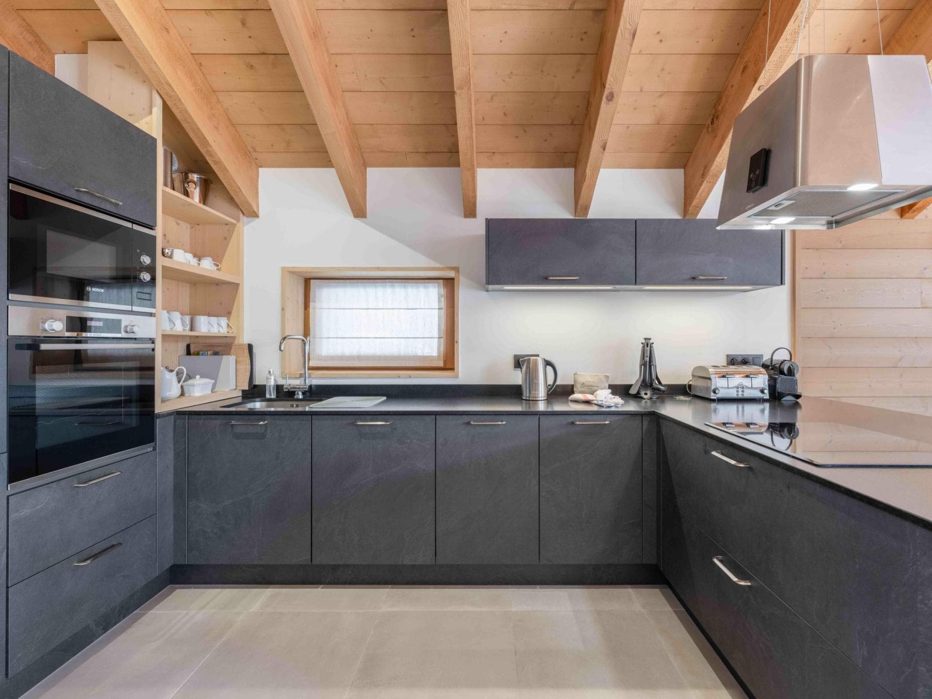 Kitchen with induction cooktop and built-in Bosch appliances