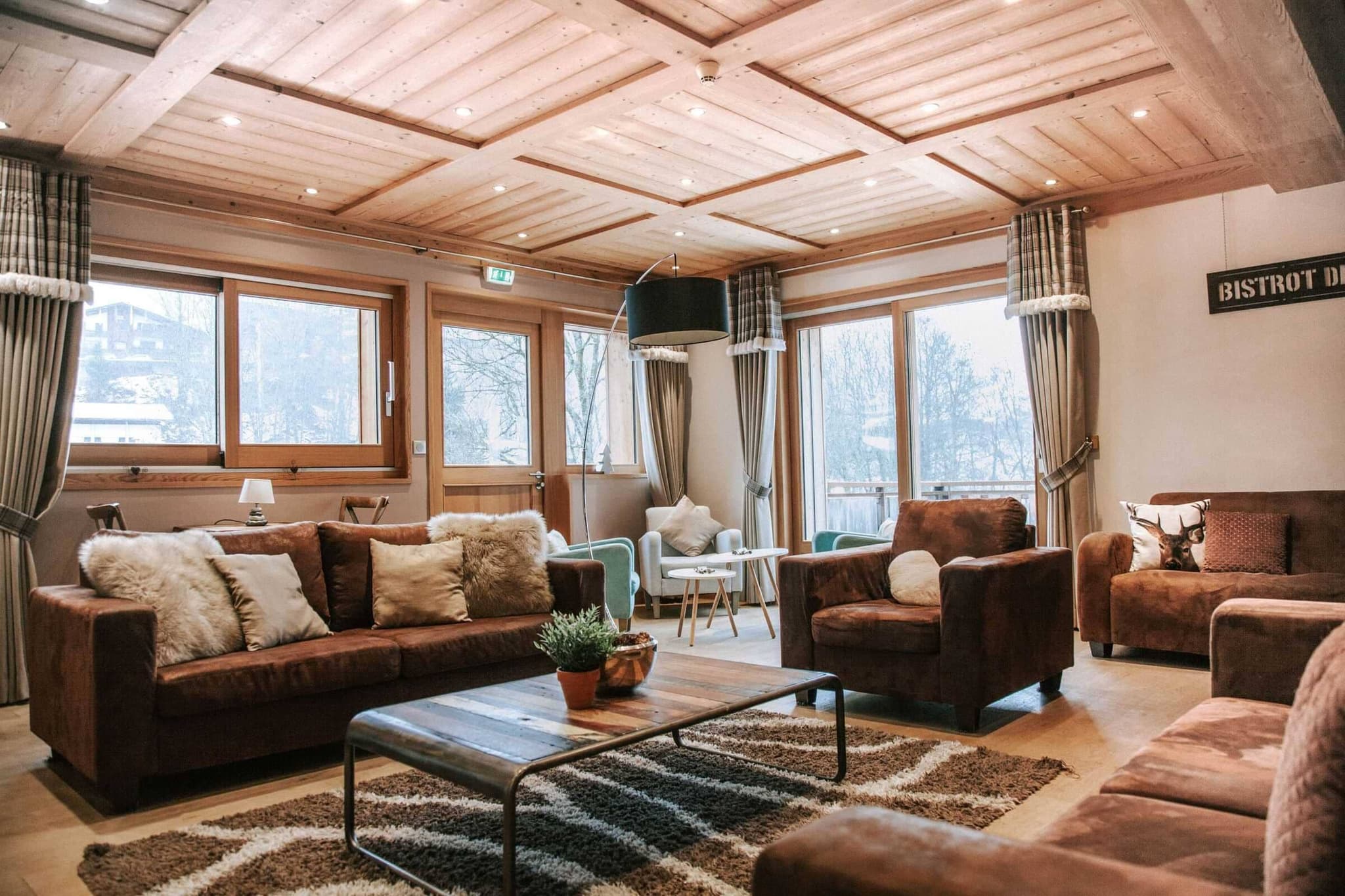 Living room with coffered wood ceiling and seating for 8
