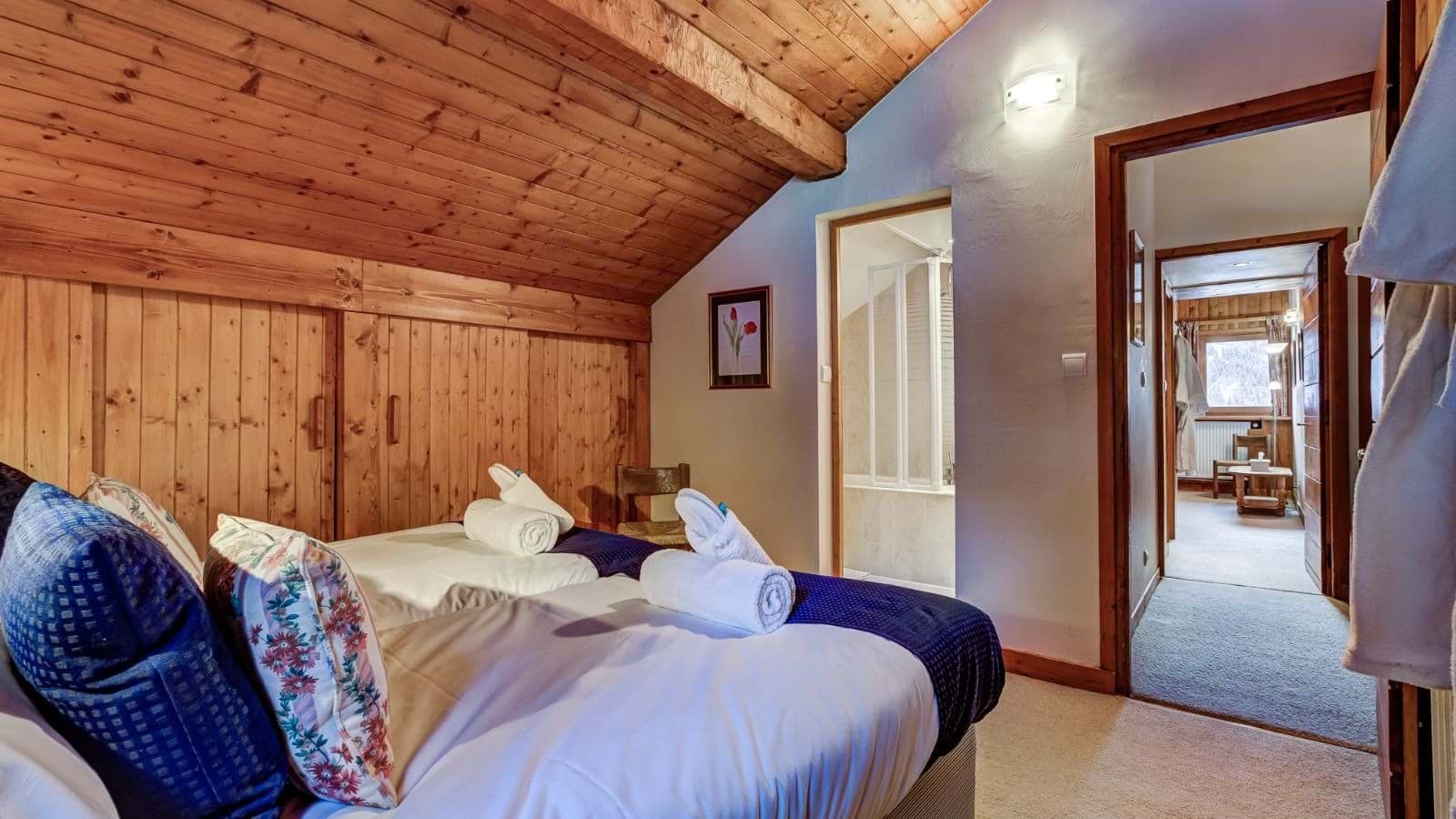 Attic bedroom with twin beds and ensuite bathroom