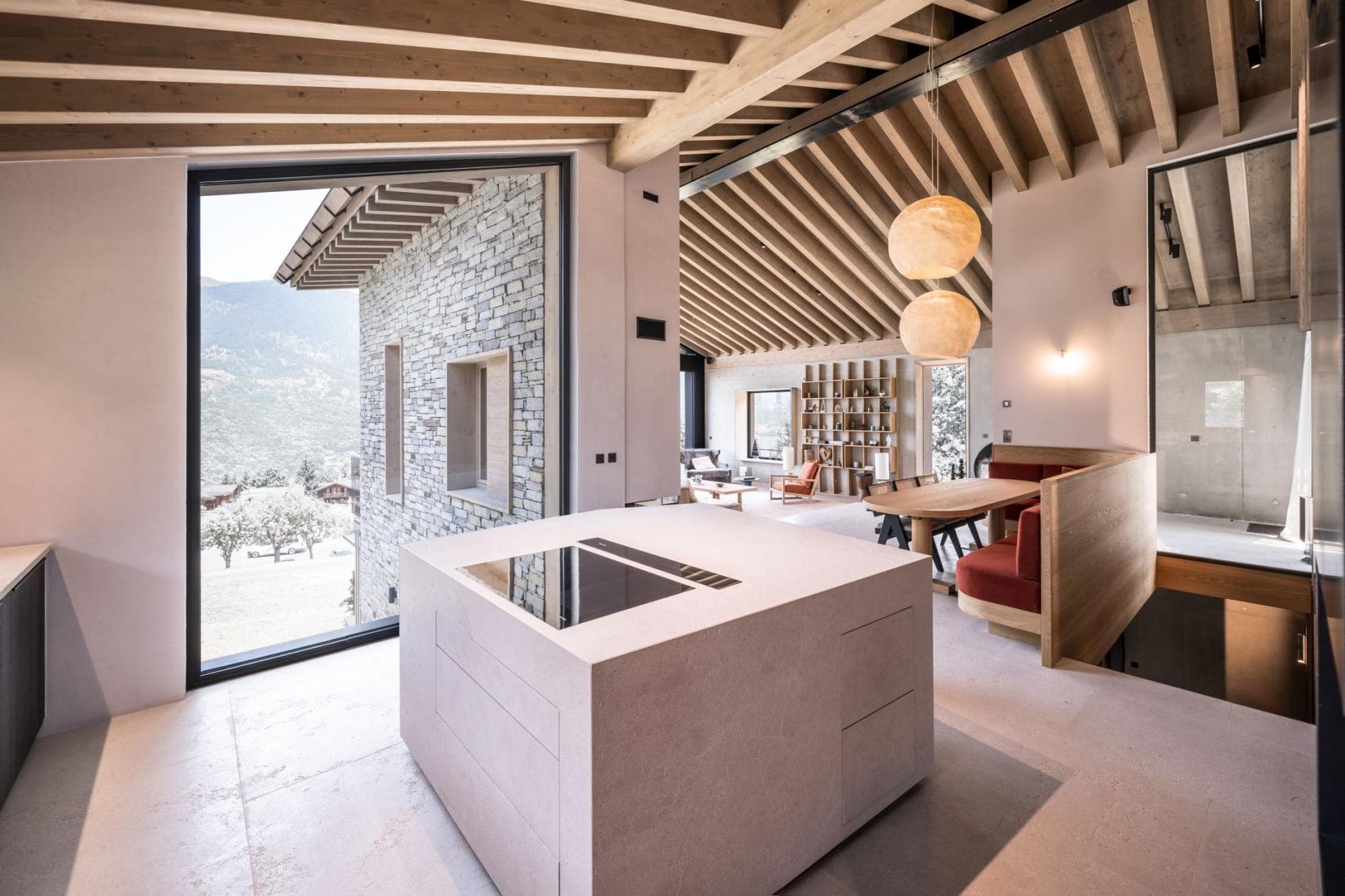 Kitchen island with induction cooktop and mountain views
