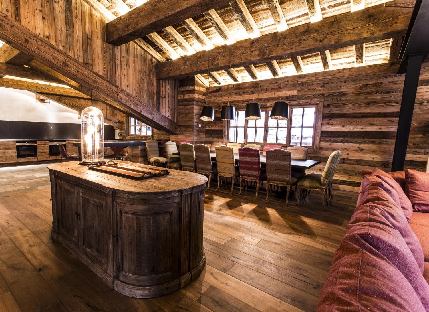 Open-plan dining area seats 12; features reclaimed wood and timber beams
