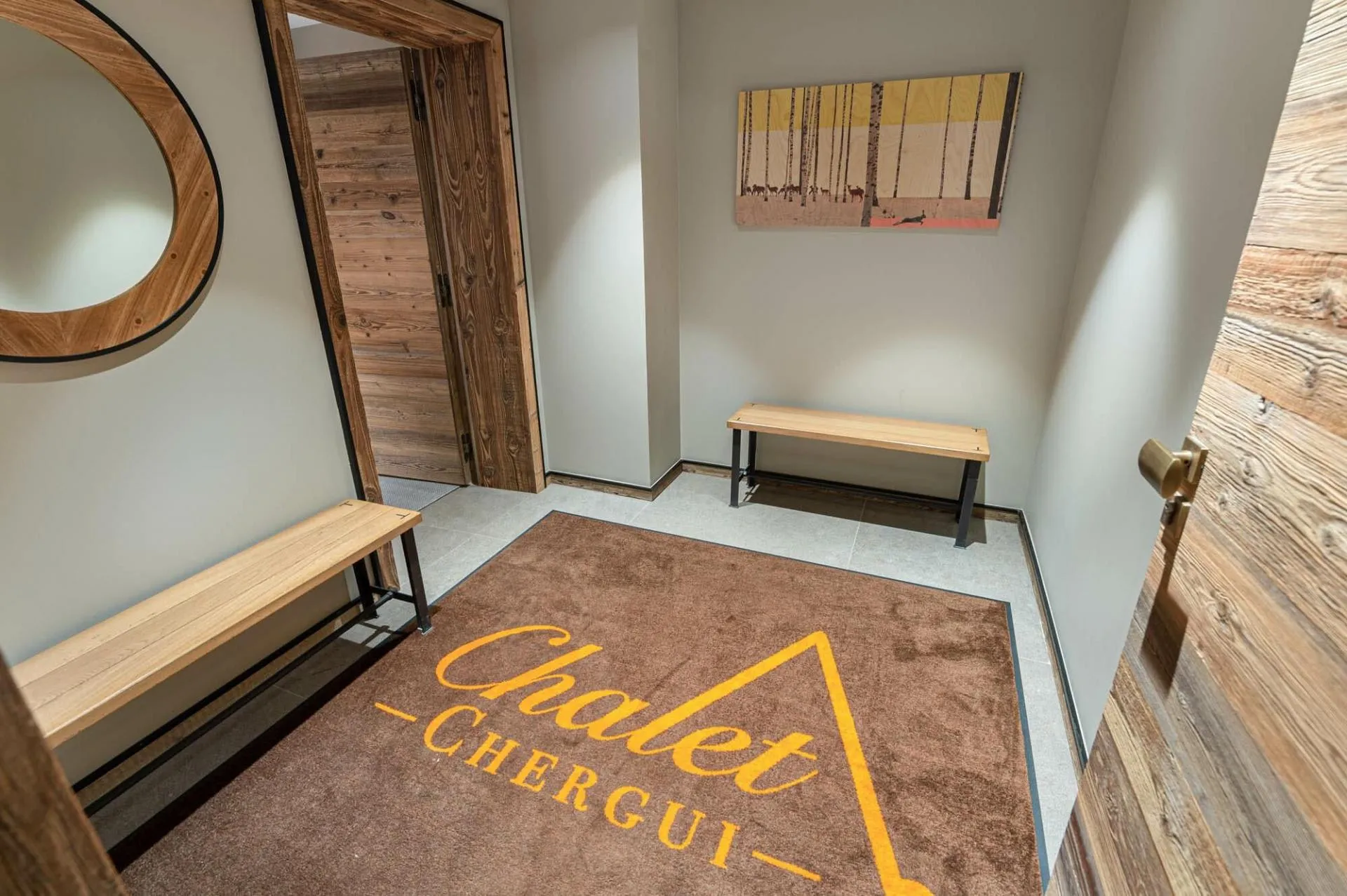 Entrance hall with bench seating and timber doors