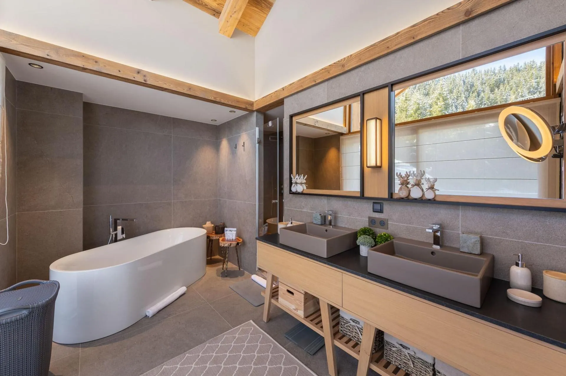 En-suite bathroom with a freestanding bath and twin basins