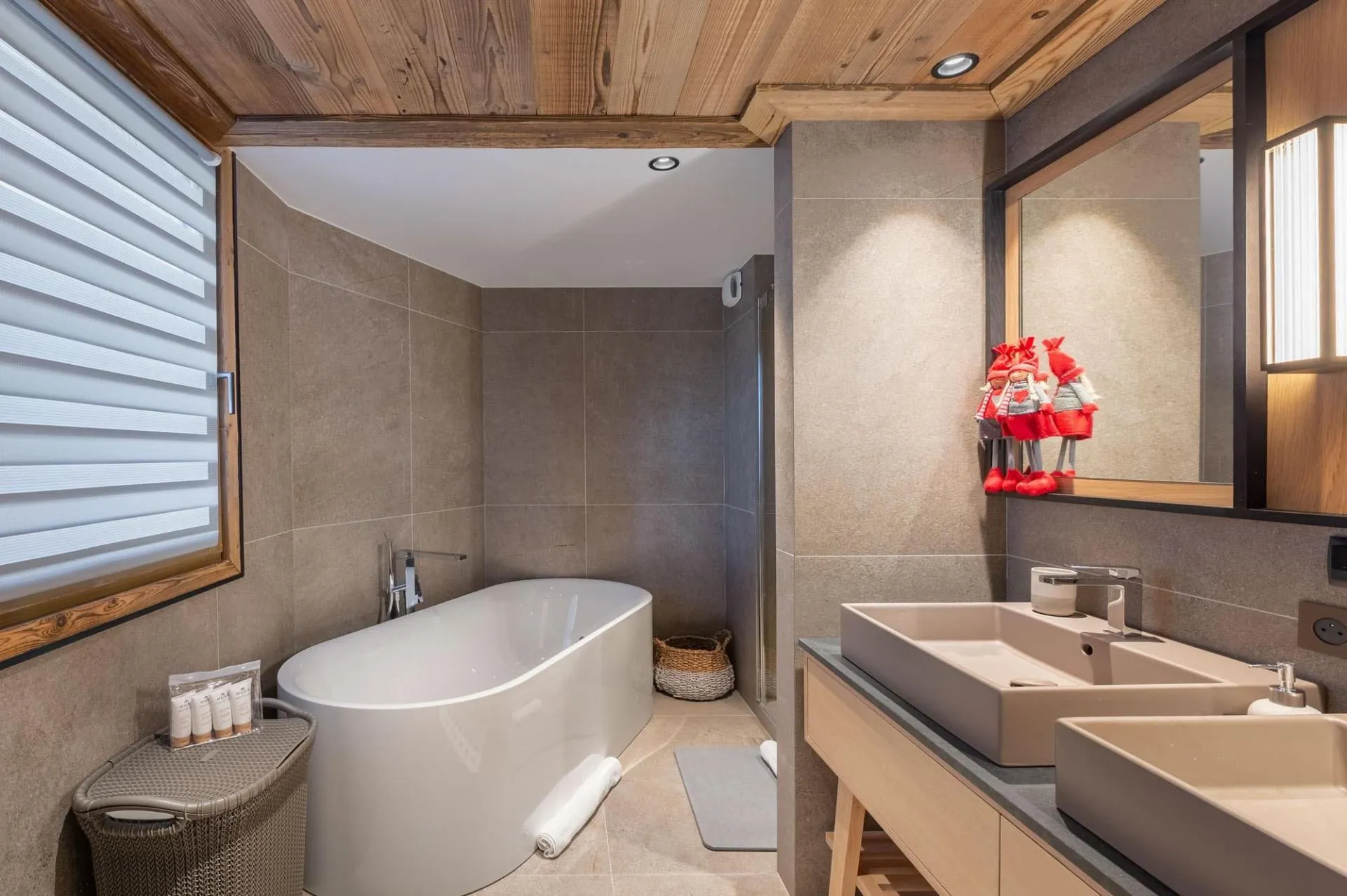 En-suite bathroom with a freestanding bath and twin basins