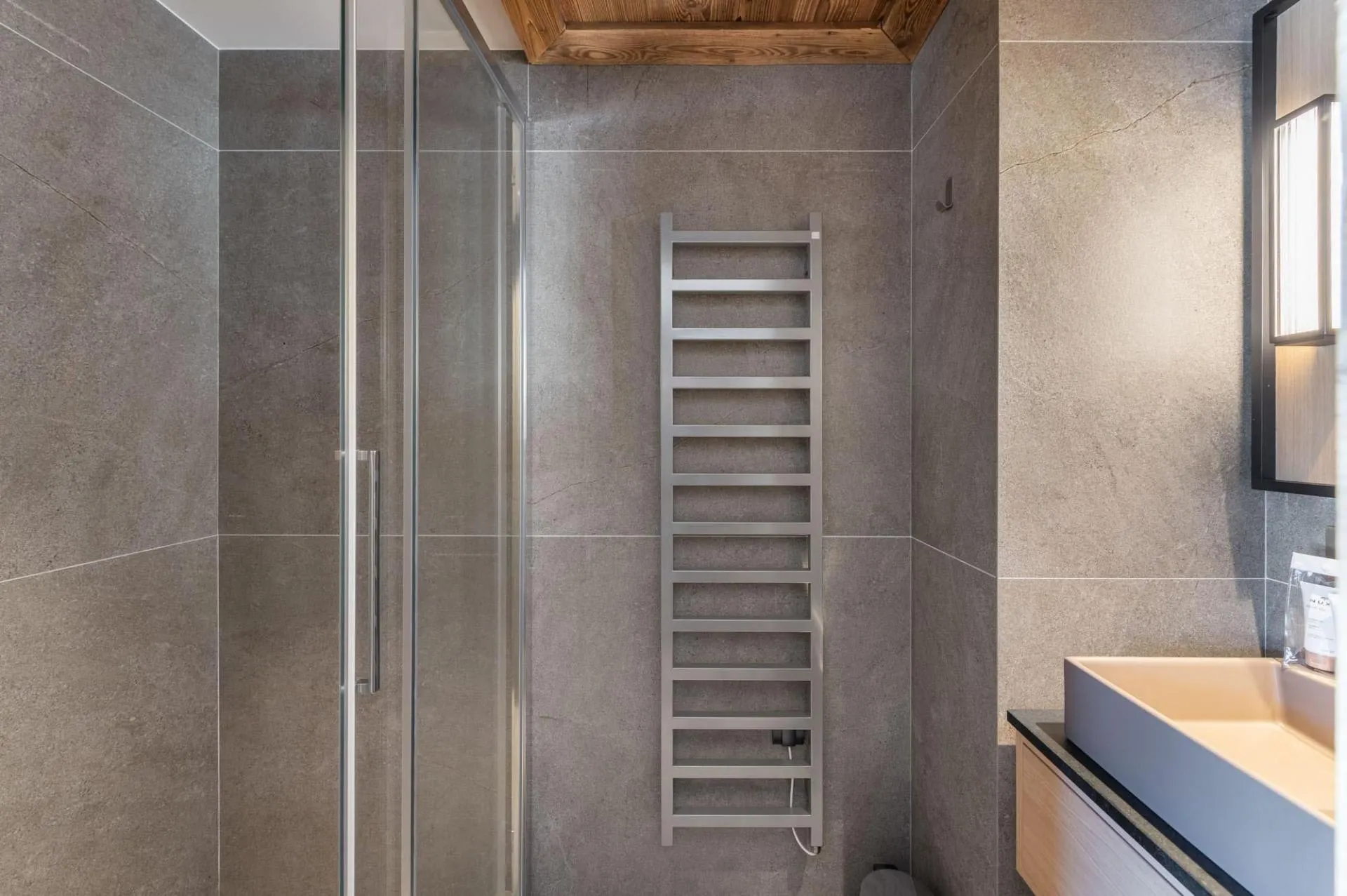En-suite shower room with a heated towel rail