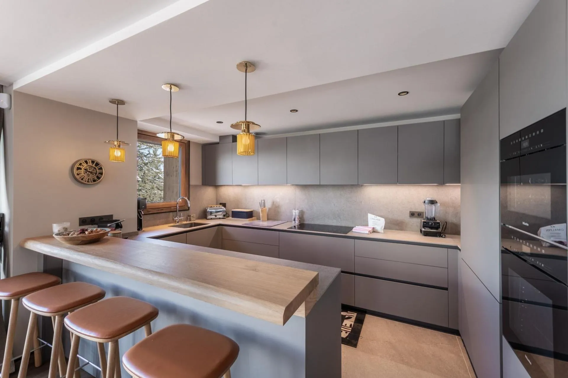 Open-plan kitchen with breakfast-bar seating