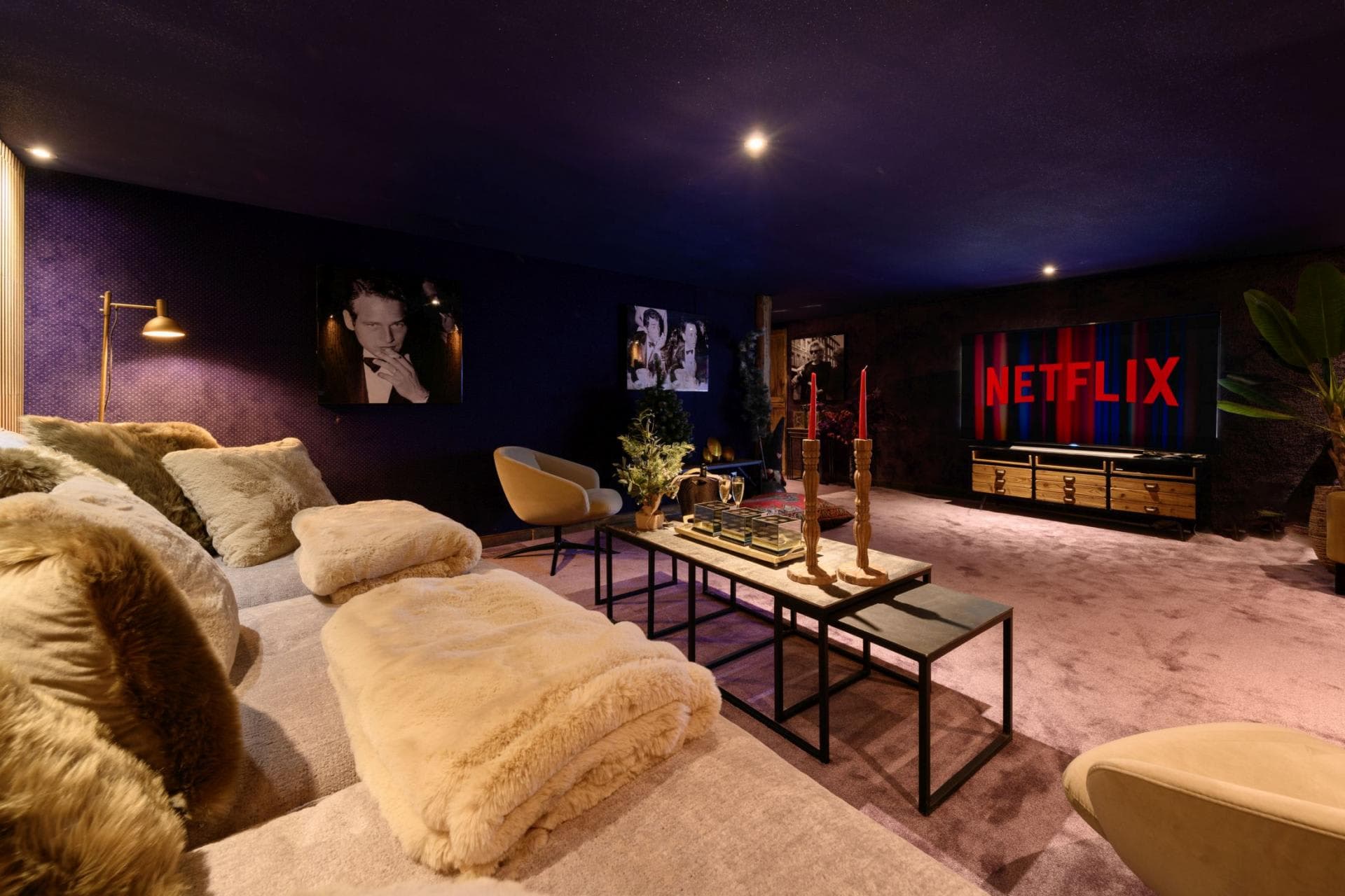 Media room with 75-inch smart TV and deep sectional seating