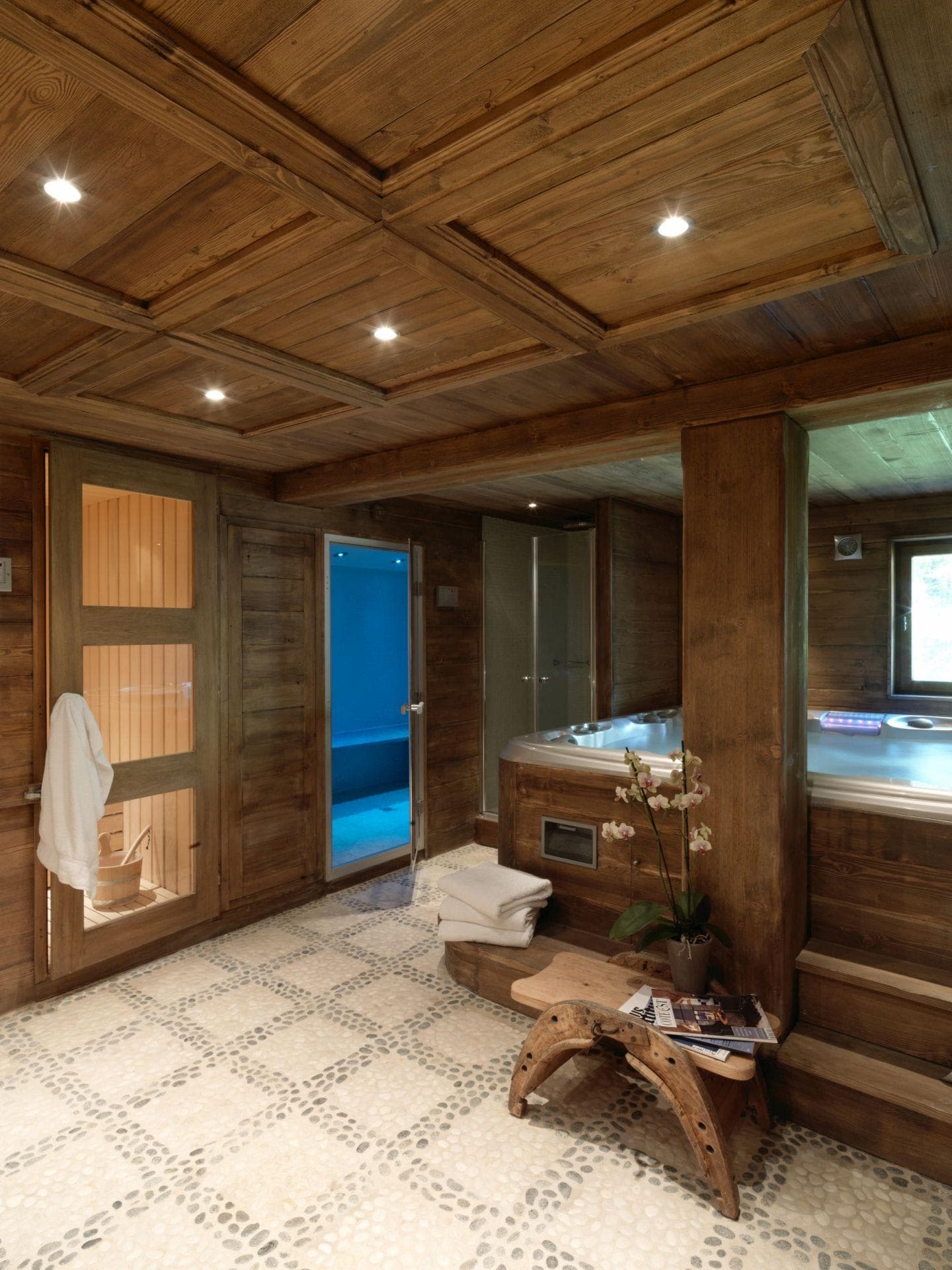 Spa room with indoor hot tub, cedar sauna, and steam room
