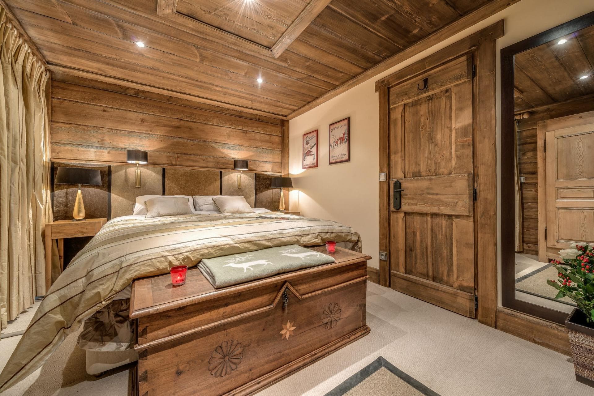 Guest bedroom with king bed and reclaimed wood paneling