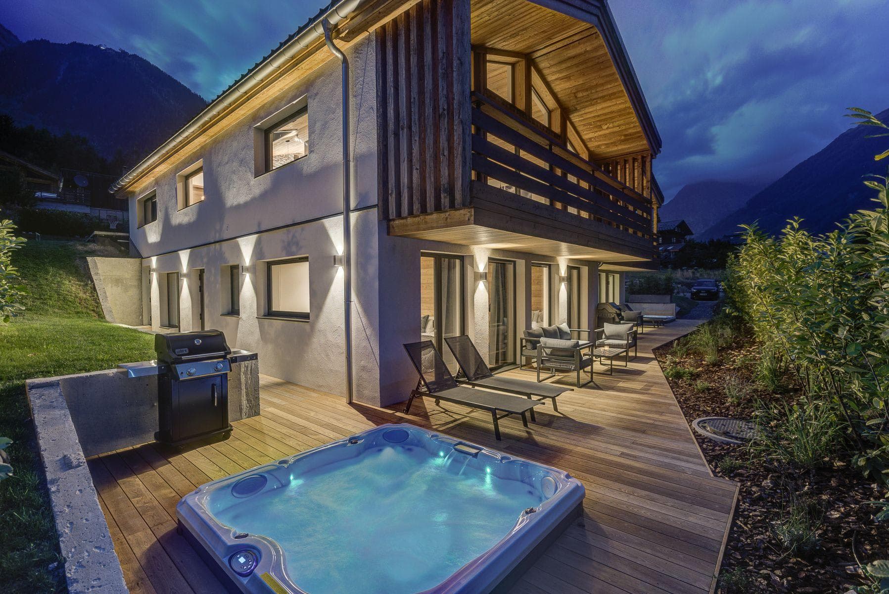 Lower deck with hot tub, gas grill, and mountain views