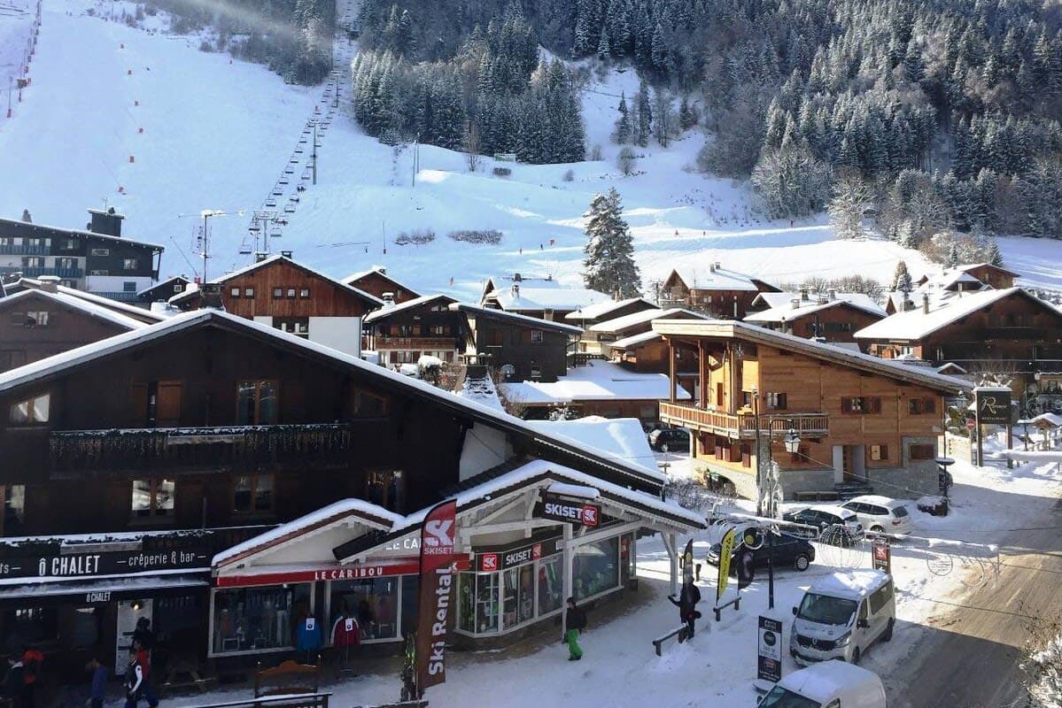 Ski village view with chairlift access and nearby rental shop