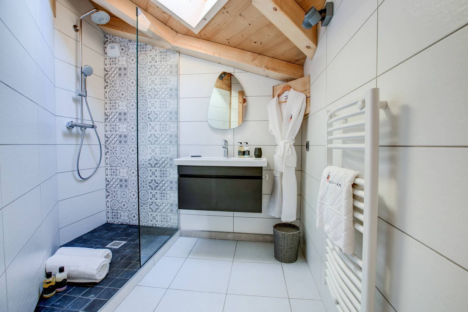 Bathroom with walk-in shower and heated towel rack