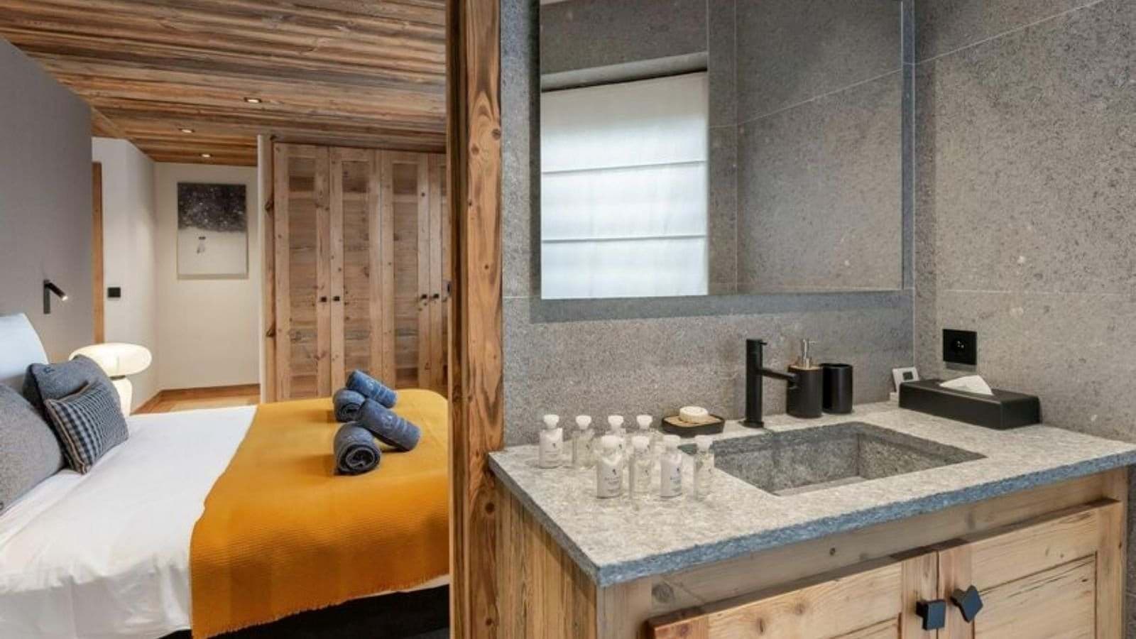 Ensuite bathroom with stone vanity and integrated bedroom access