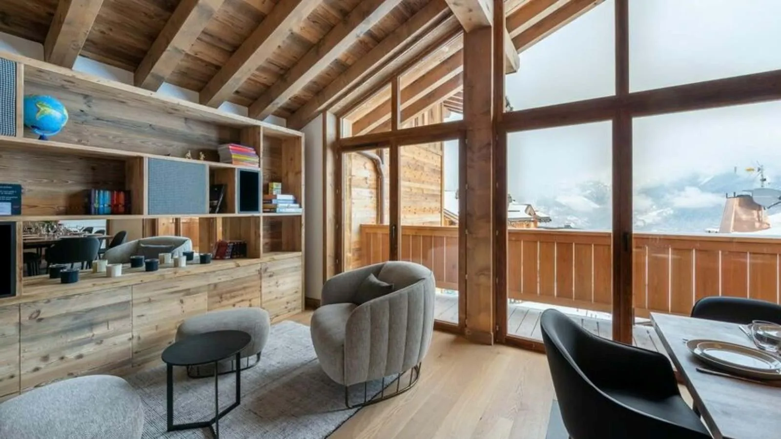 Reading area with armchairs and full-height windows
