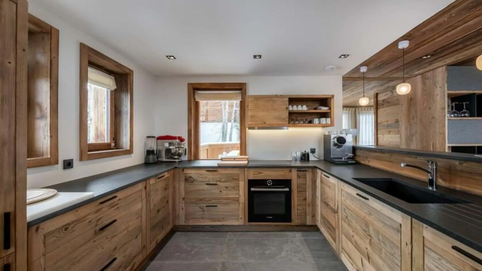 Fitted kitchen with induction hob and integrated appliances