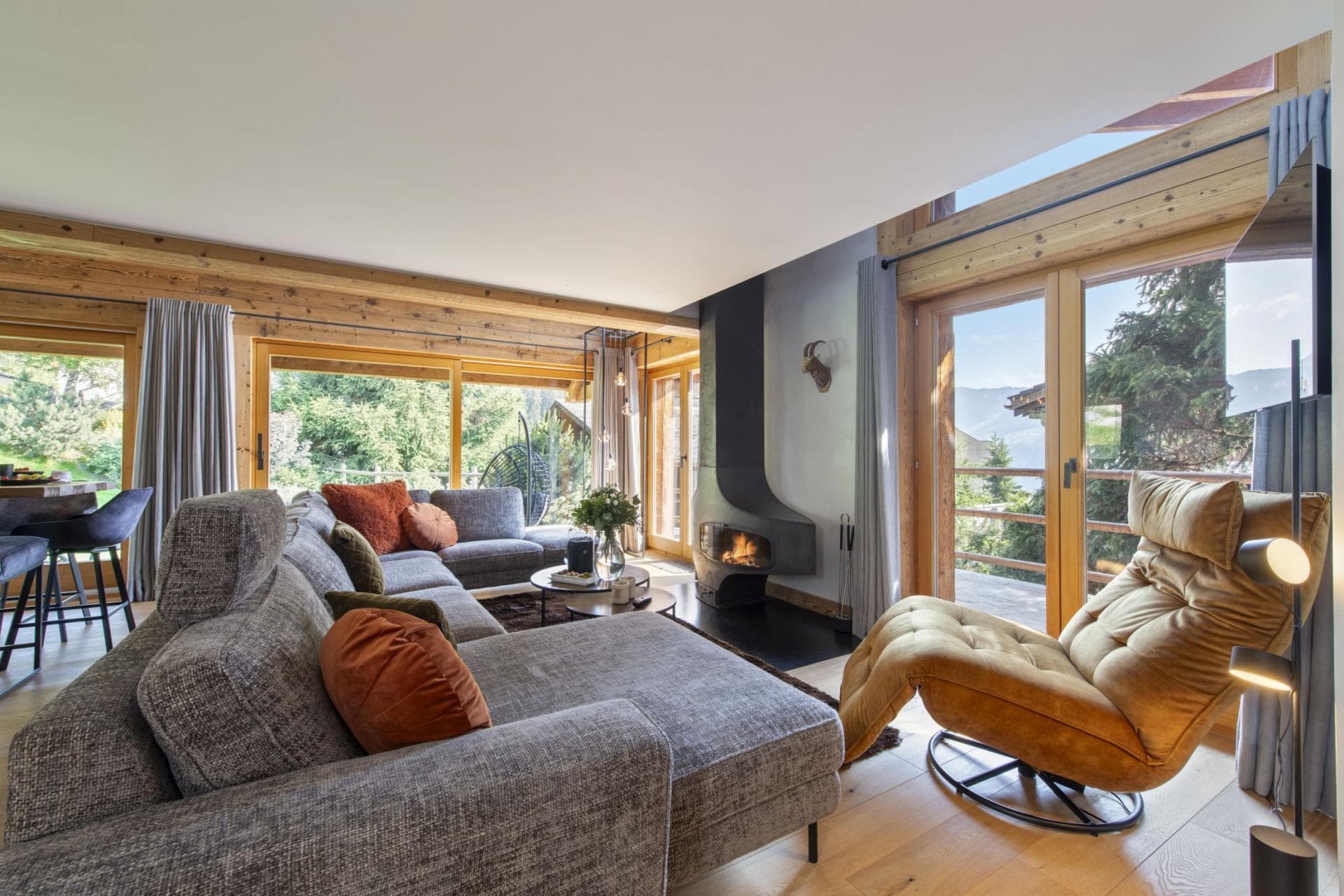 Living area with wood-burning fireplace and deck access