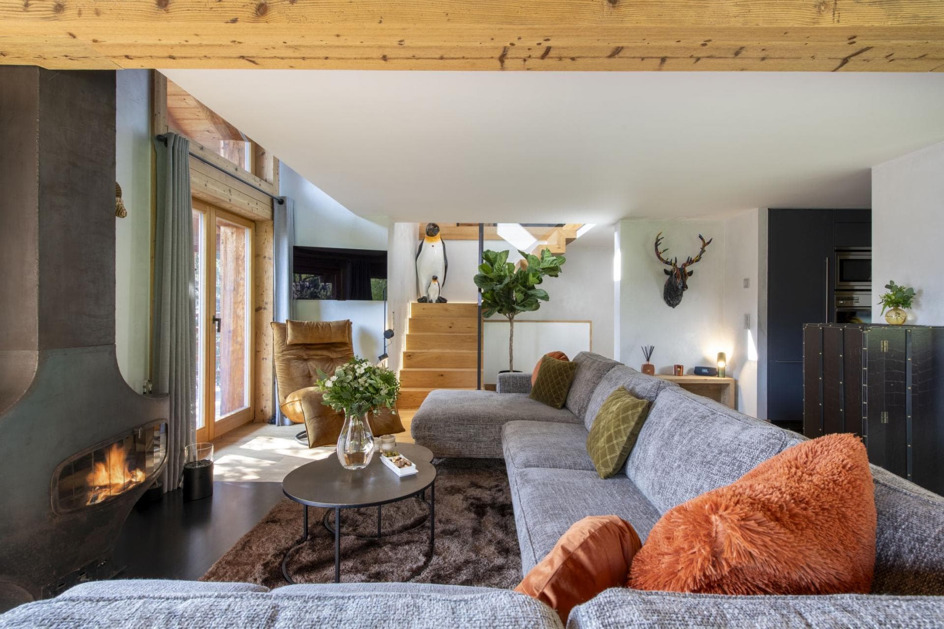 Living area with wood-burning fireplace and sectional seating for 6