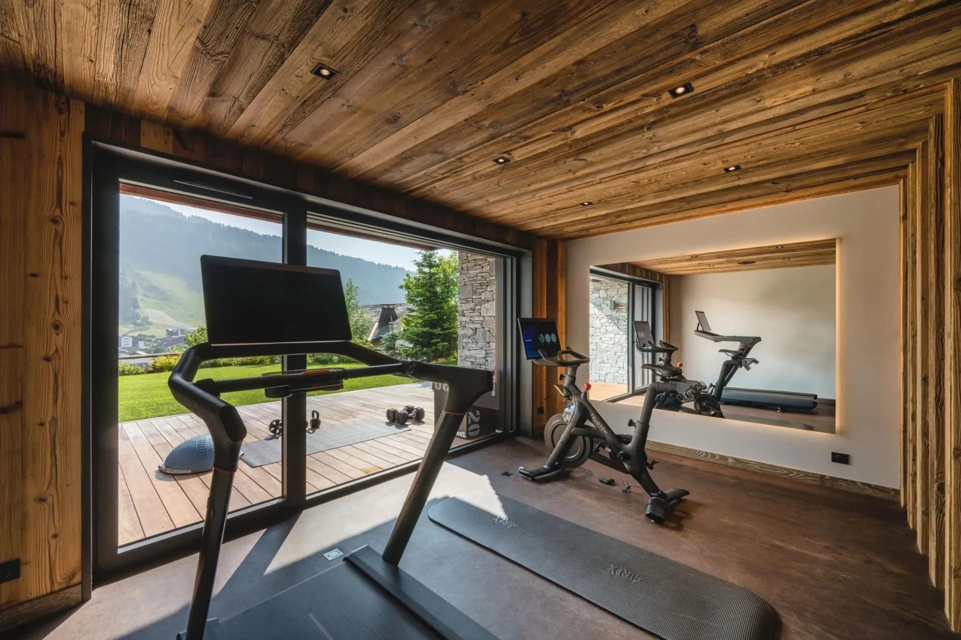 Private gym with Peloton bike, treadmill, and valley views