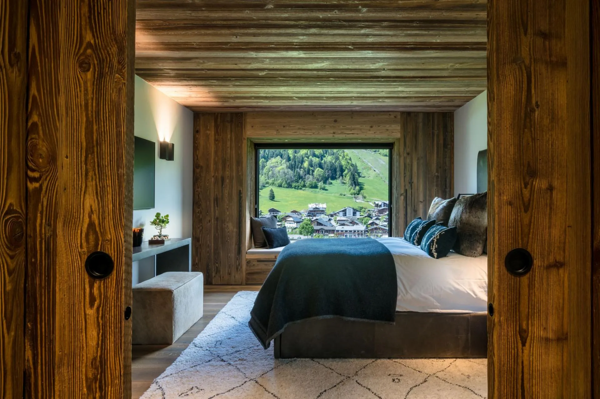Primary bedroom with window seat and valley views