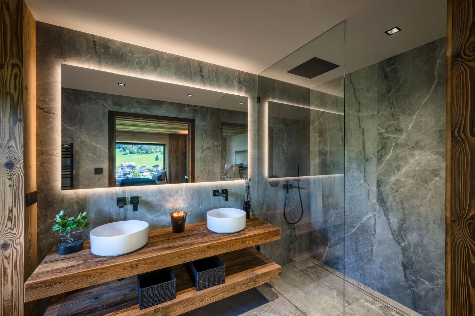 Bathroom with dual vessel sinks and walk-in rainfall shower