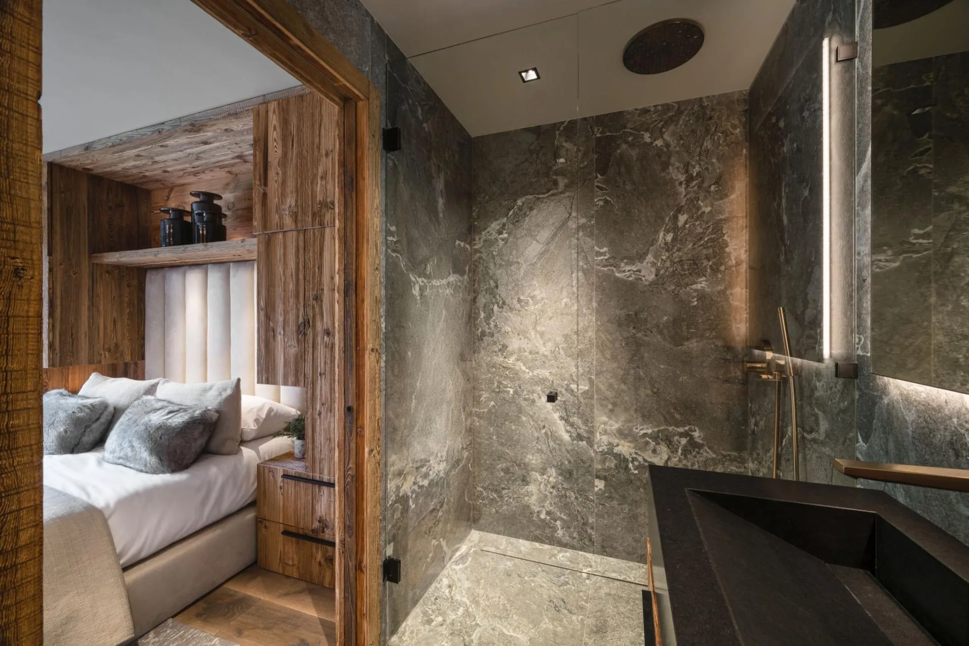 Ensuite bathroom with rainfall shower and marble stone finish