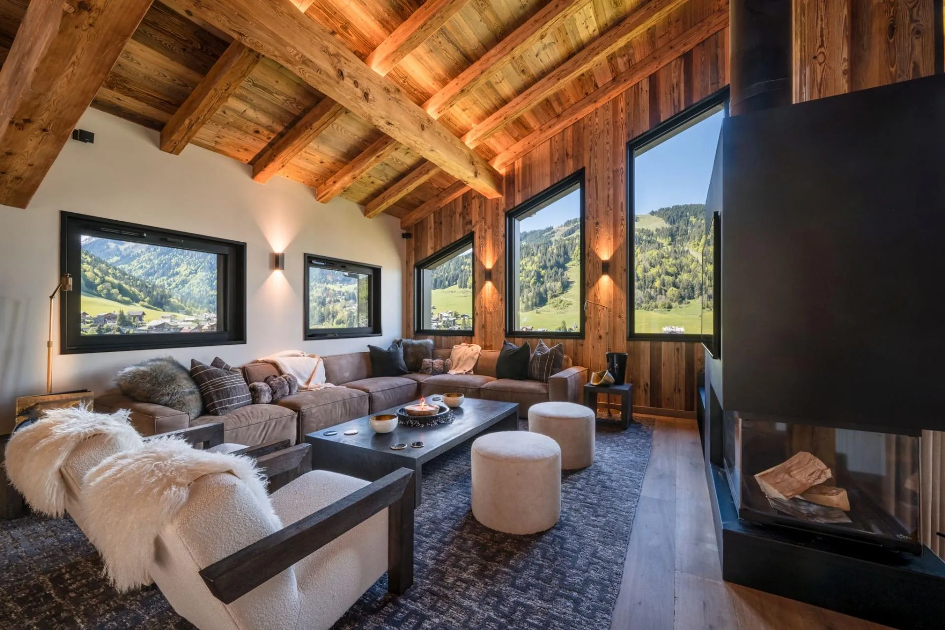 Living area with wood-burning fireplace and mountain valley views