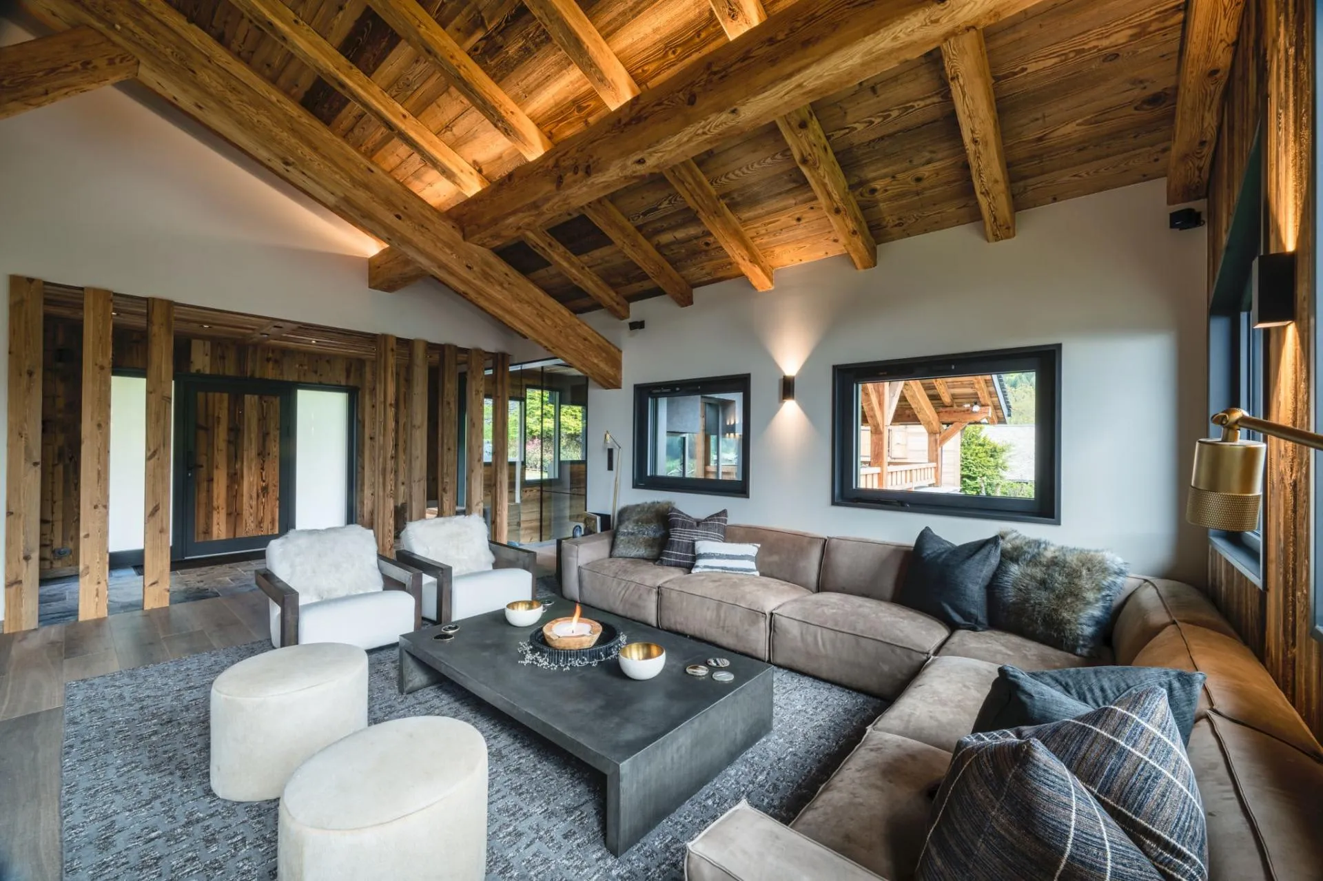 Living area with vaulted timber beams and seating for 8 guests