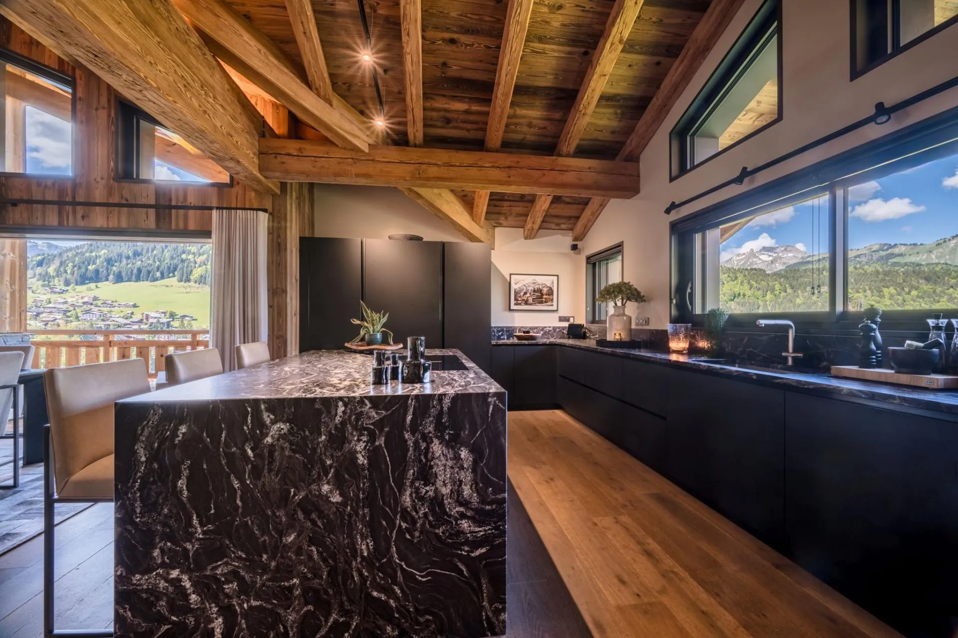 Kitchen with marble waterfall island and valley mountain views