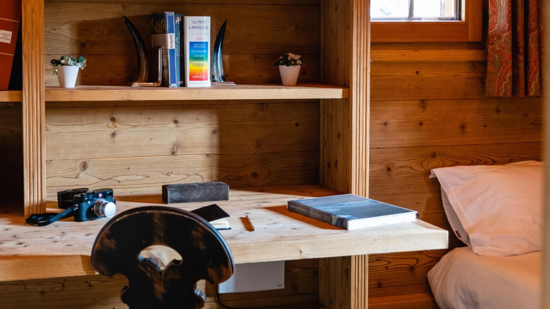 Built-in pine desk and shelving with bedside access