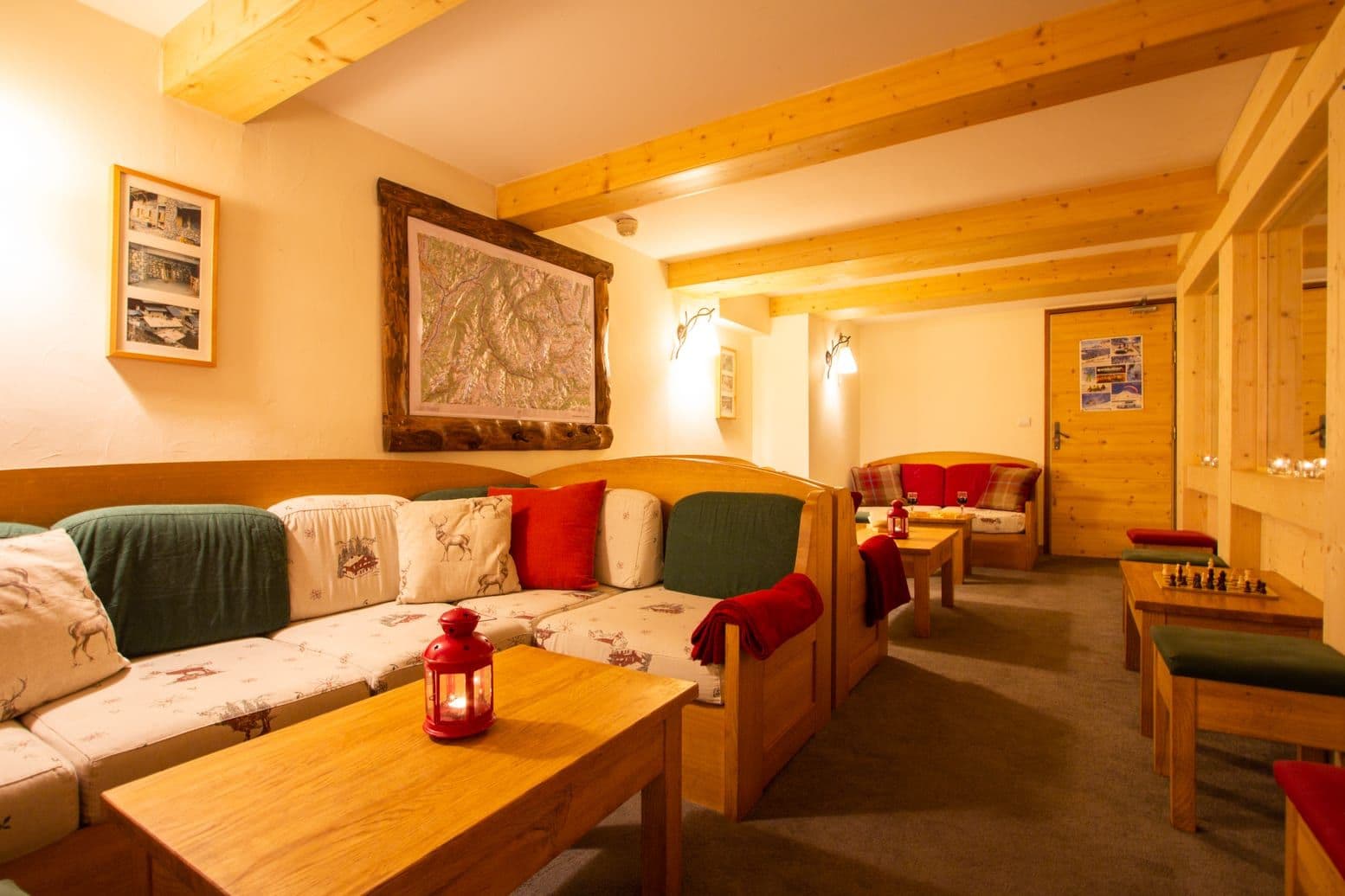 Shared lounge area with booth seating and chess table