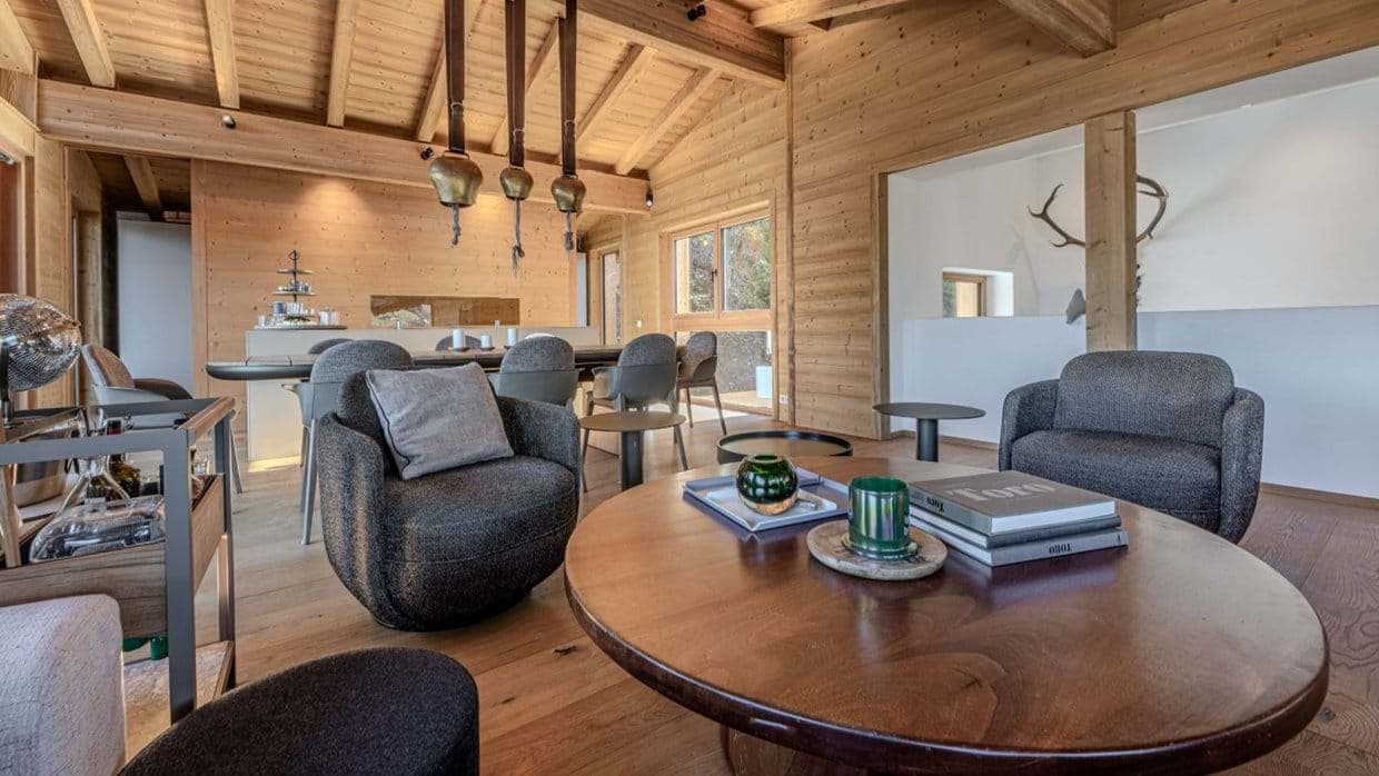 Living area with bar cart and vaulted wood ceilings
