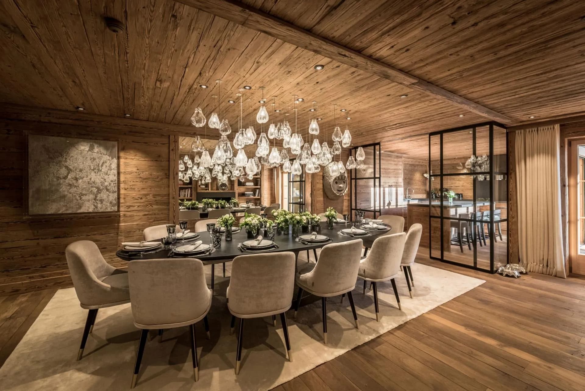 Dining area seats 10; reclaimed wood paneling and views of kitchen