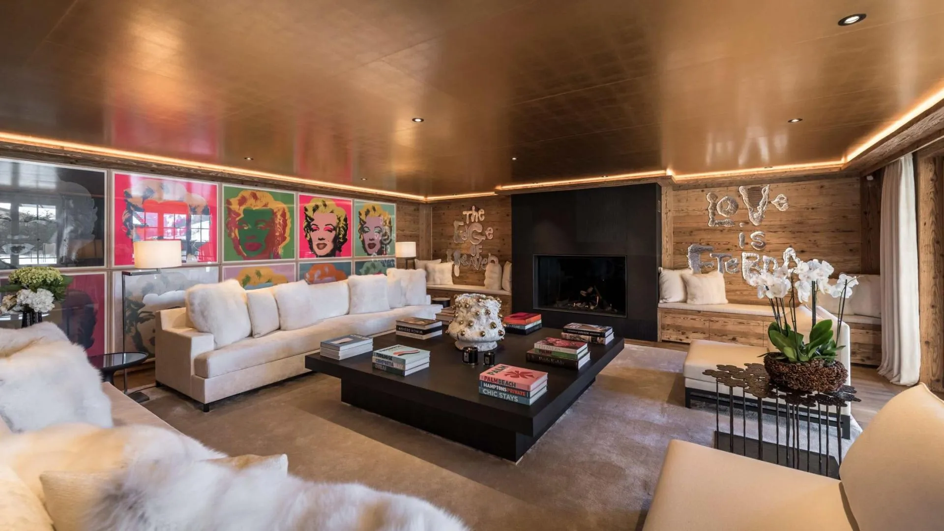 Living area with wood-burning fireplace and integrated window seating