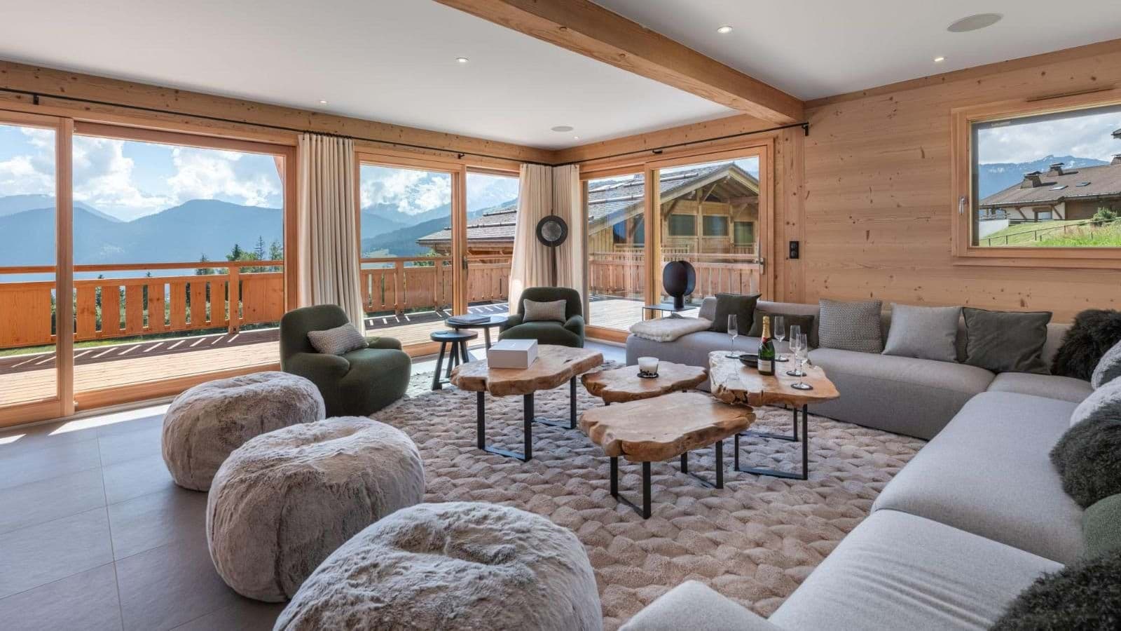 Living area with terrace access, mountain views, and seating for 12