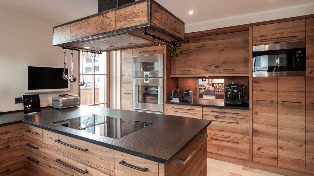 Kitchen with induction cooktop and built-in espresso machine
