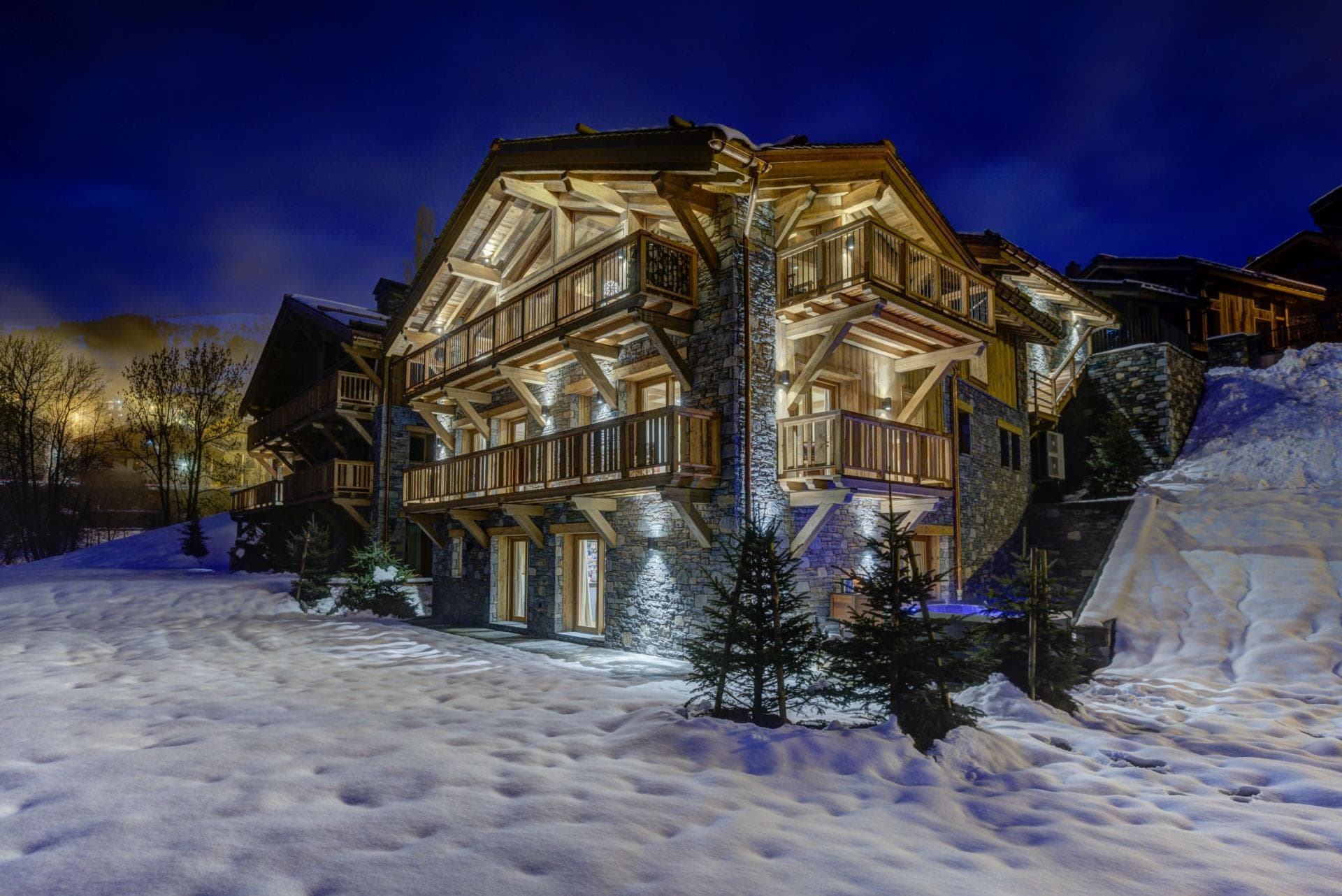 Ski-in/ski-out chalet exterior with private balconies and ground-floor hot tub
