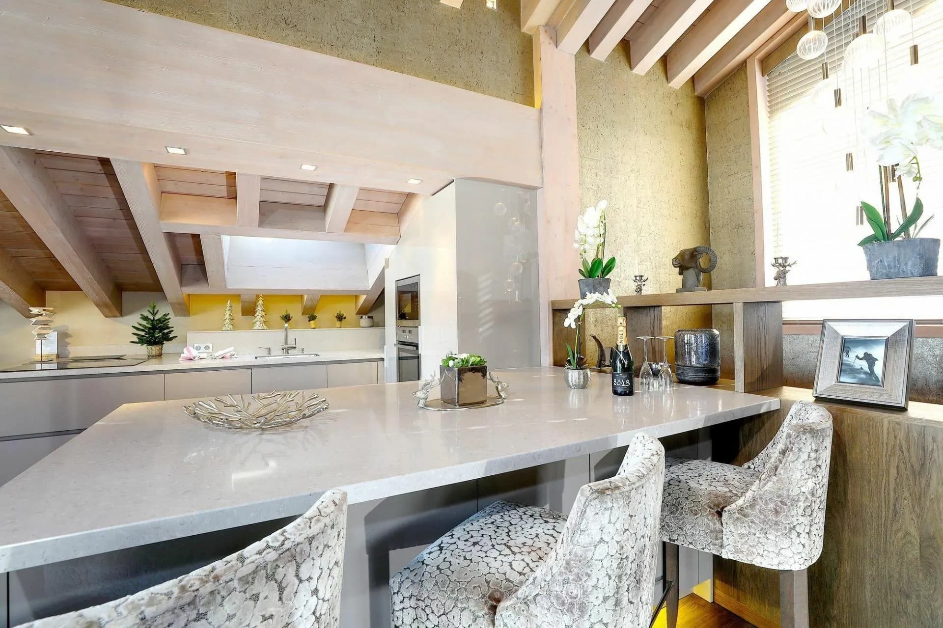 Open kitchen and breakfast bar beneath exposed beams