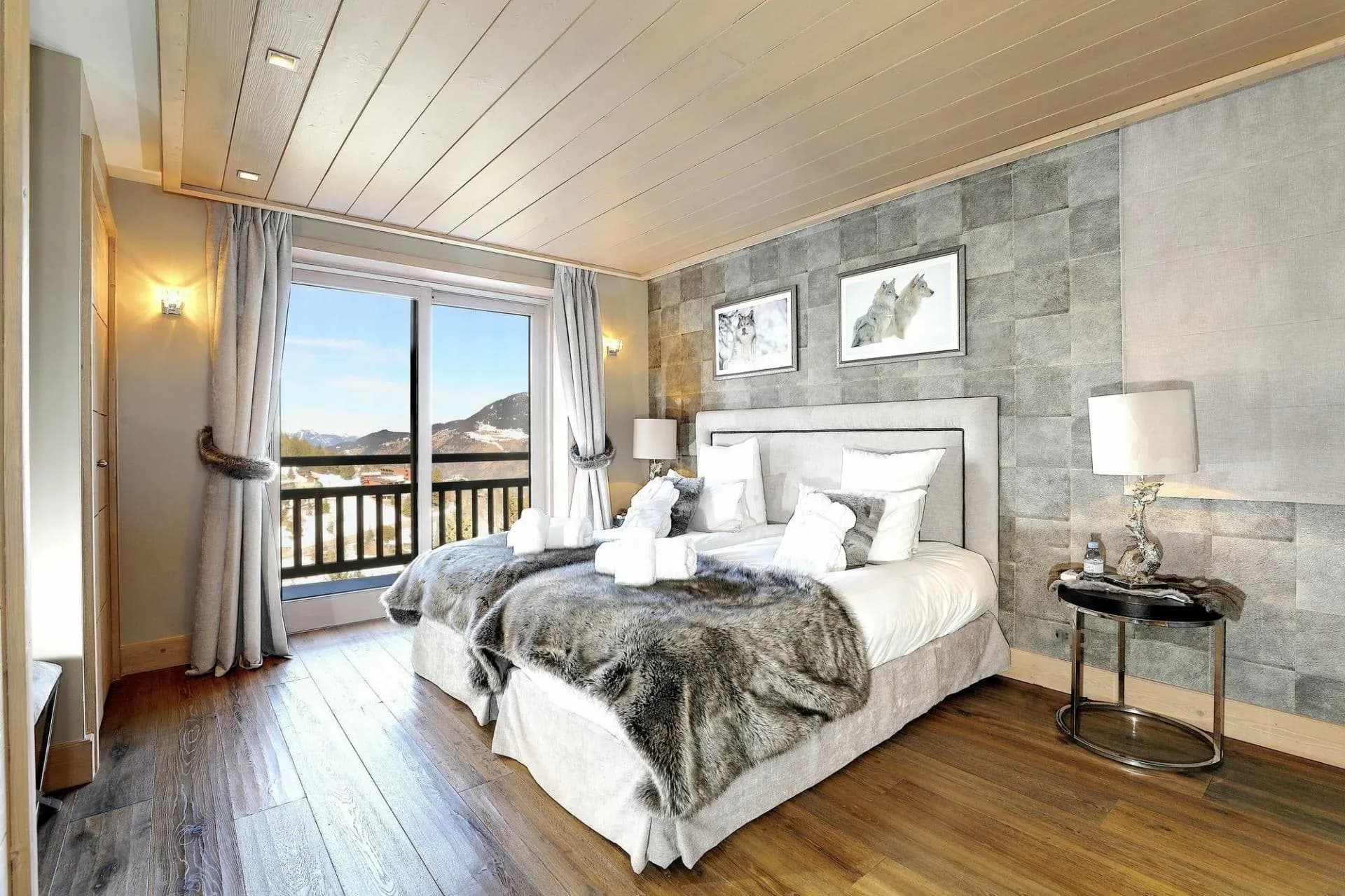 Bedroom with convertible twin beds and a private balcony