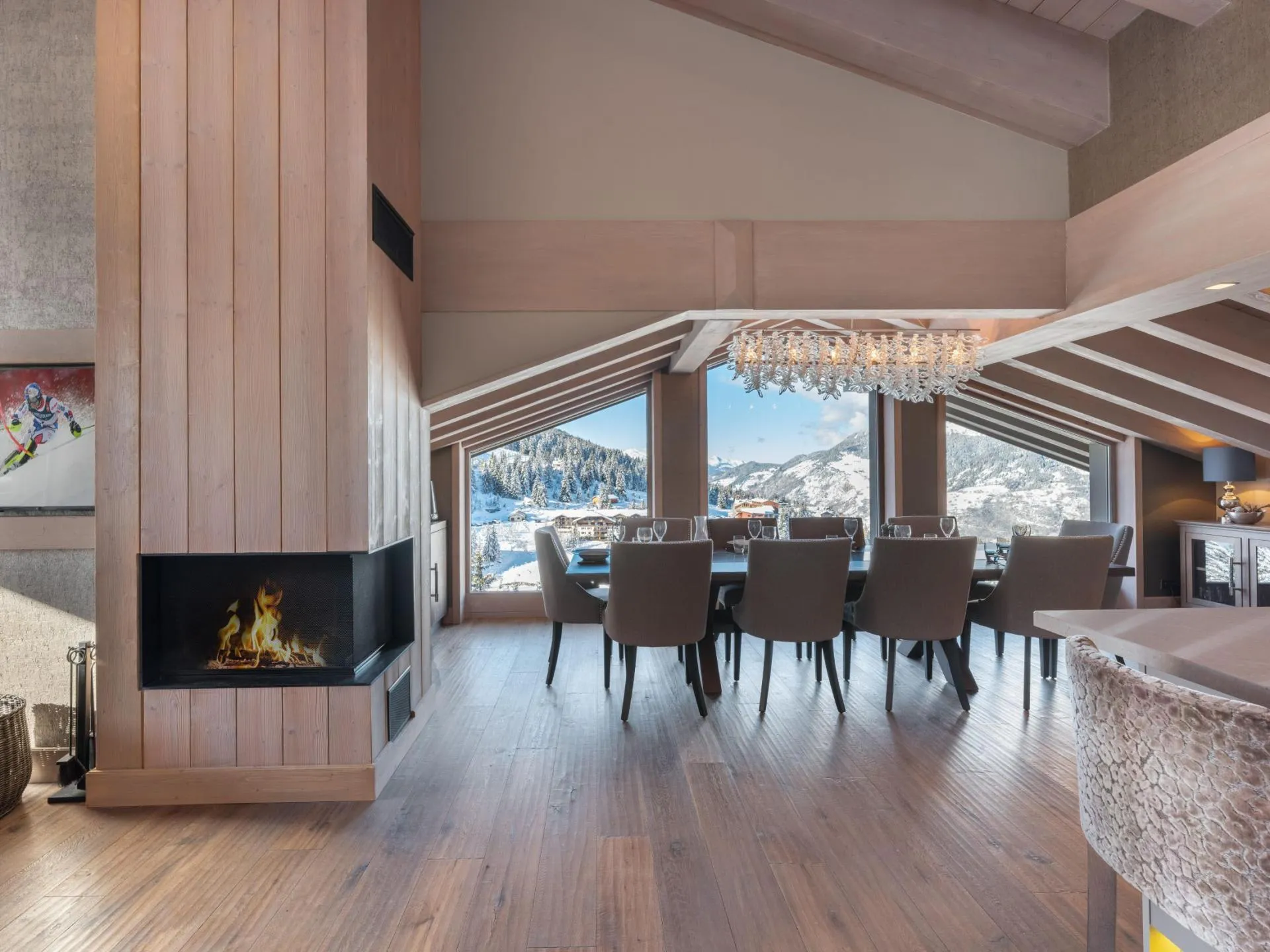 Dining area beside the fireplace with mountain views