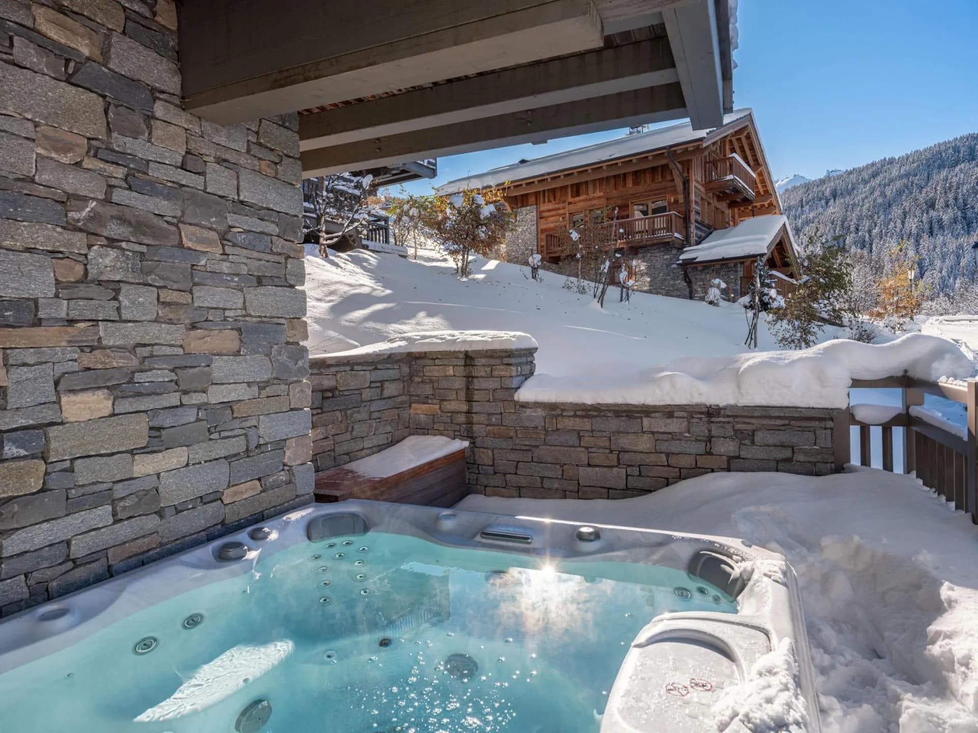 Covered outdoor jacuzzi with mountain views