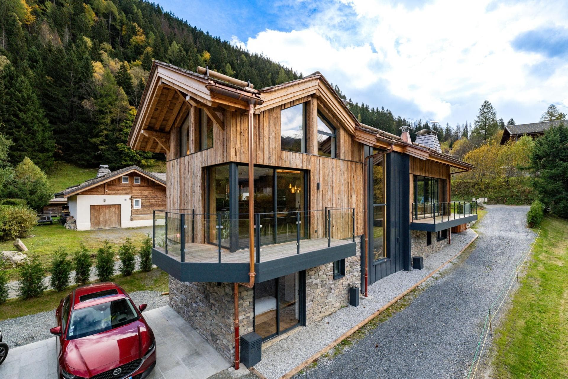 Mountain chalet with private driveway and glass-railed balconies