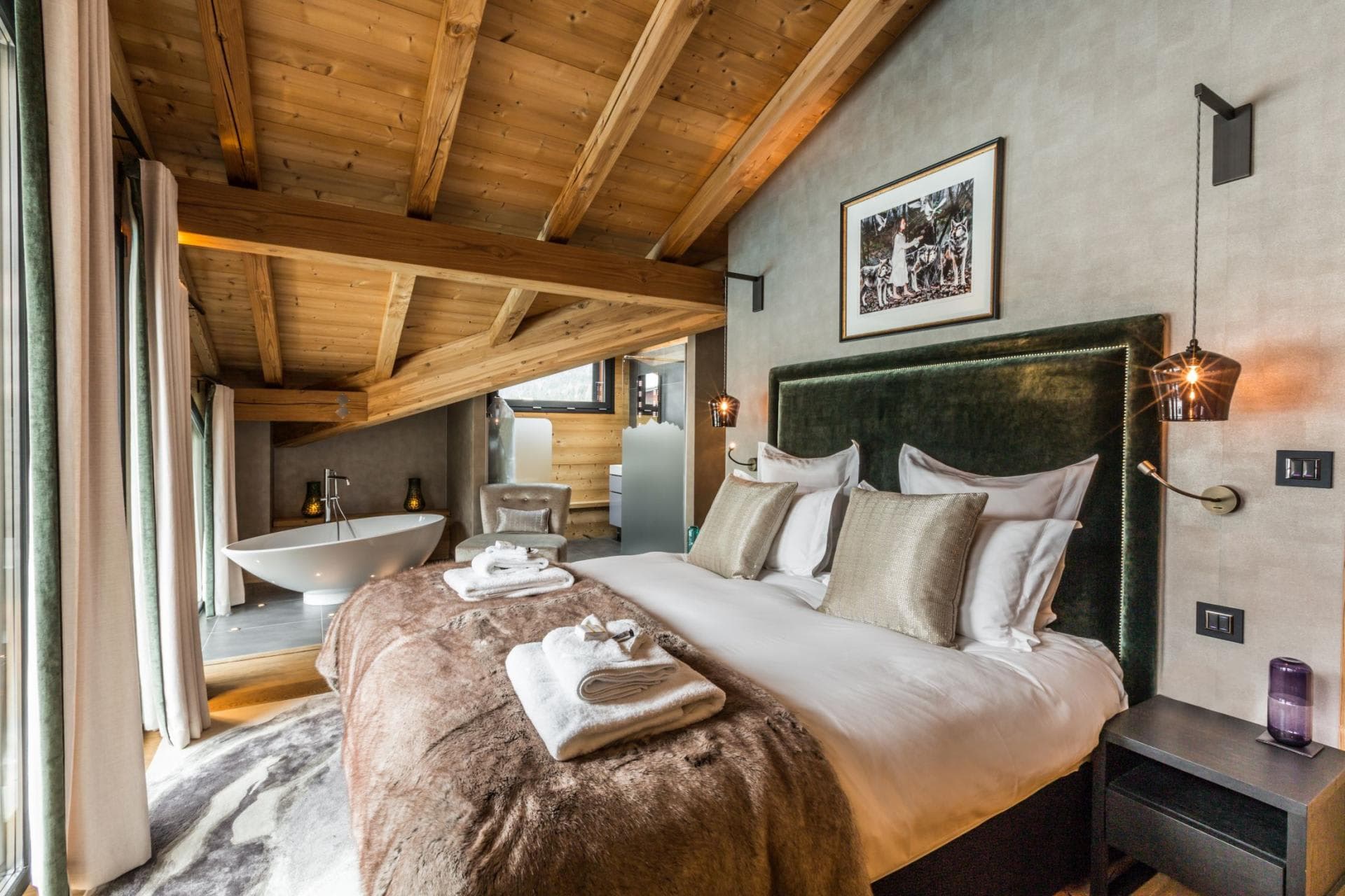 Primary bedroom with king bed and in-room soaking tub