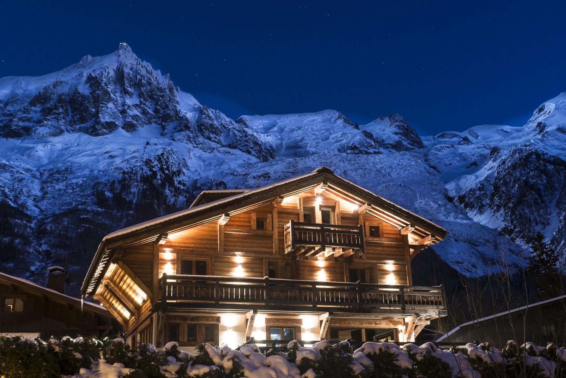 Chalet exterior with multiple balconies and direct views of the Mont Blanc massif