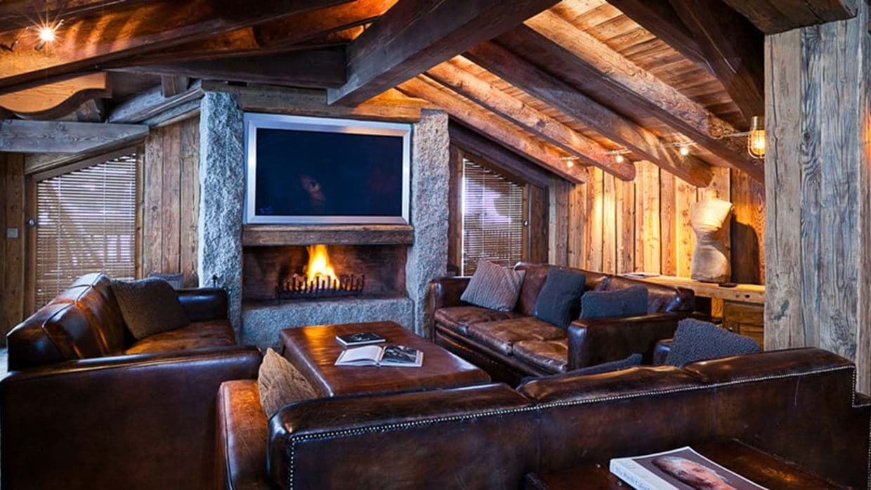 Living area with wood-burning fireplace and leather seating for 8