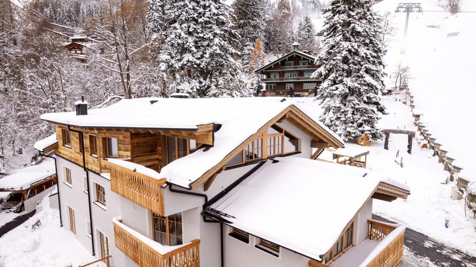 Chalet exterior with multiple private balconies and direct ski-in/ski-out access