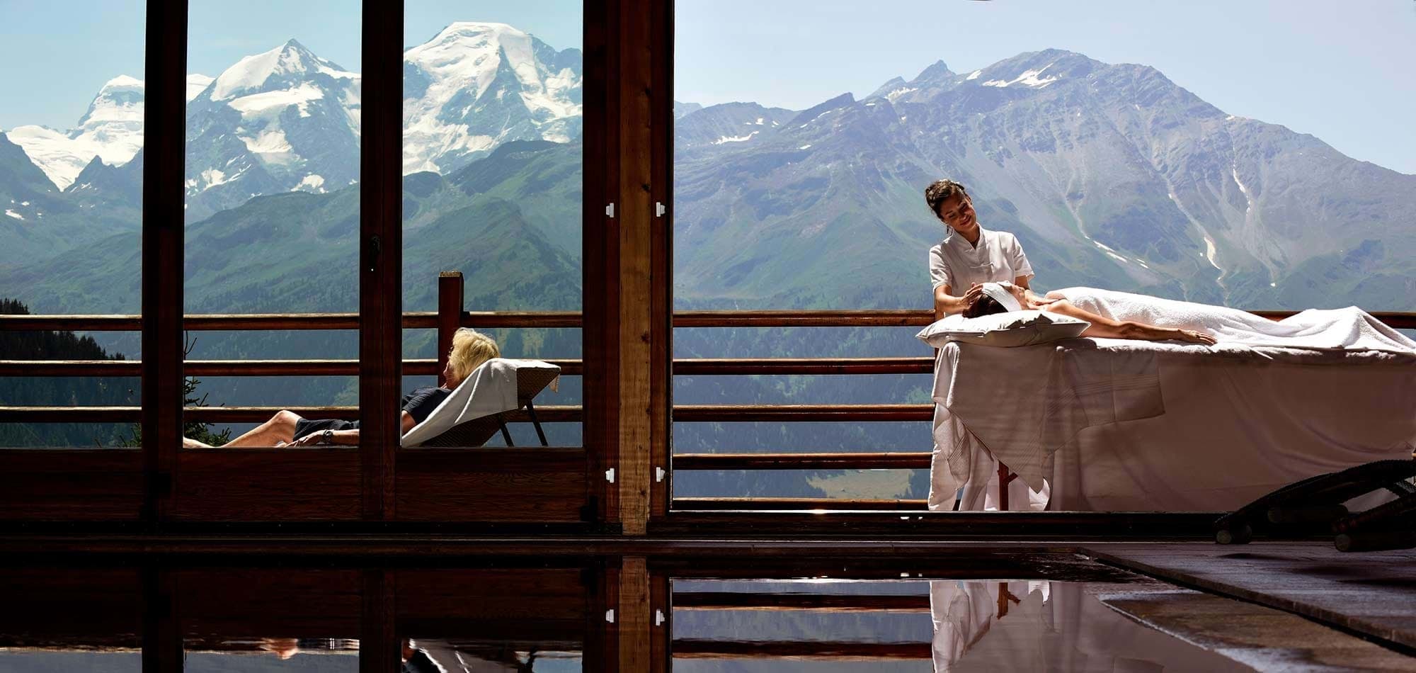 Spa area with massage table and panoramic mountain views