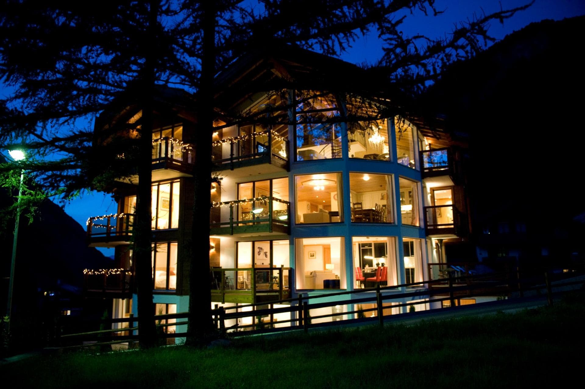 Four-level chalet featuring floor-to-ceiling windows and private balconies